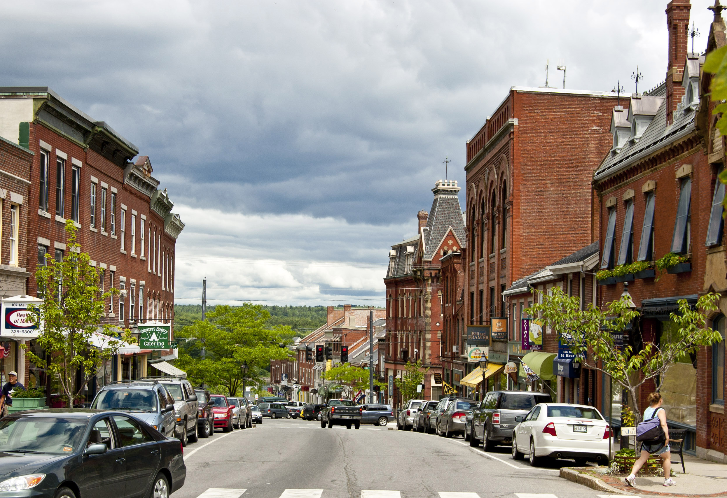 Busy downtown Belfast, Maine lined with historic brick buildings and small businesses—an evolving community embracing managed IT solutions for reliability and growth.