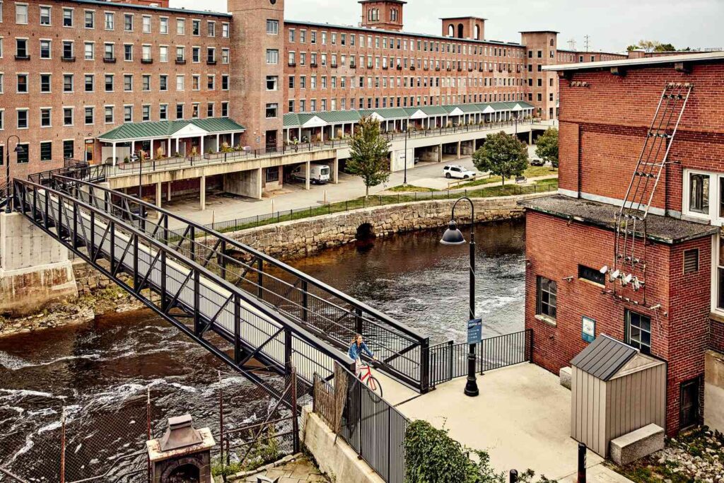 Downtown Biddeford’s revitalized mill district along the Saco River, highlighting the type of close-knit business community supported by managed IT solutions.