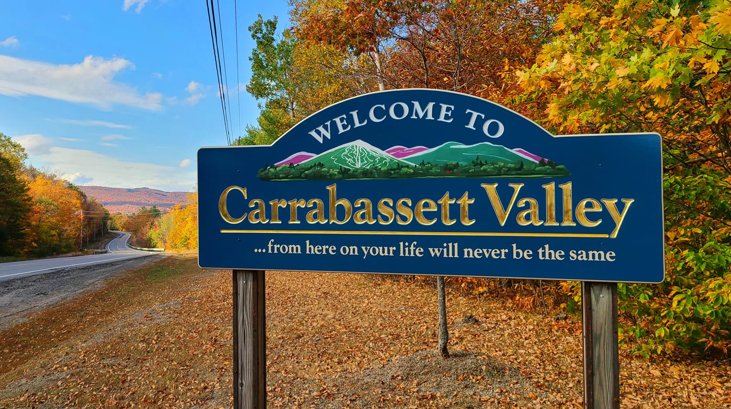 Welcome sign at the entrance to Carrabassett Valley, Maine, representing a resilient mountain town embracing managed IT for local growth and connectivity.