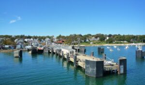View of Falmouth, Maine’s harbor pier stretching over calm waters, symbolizing steady infrastructure and support from managed IT services for local businesses.
