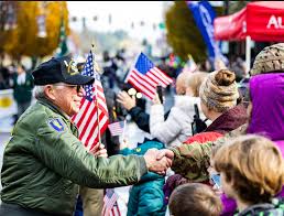 Veterans greeting families during a Frye Island community event—underscoring the need for secure, managed IT systems to support civic engagement.