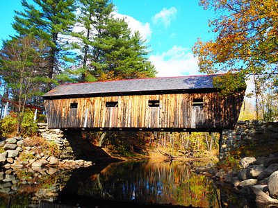 Covered bridge in Hanover, Maine representing local charm and the need for managed IT services in rural communities.