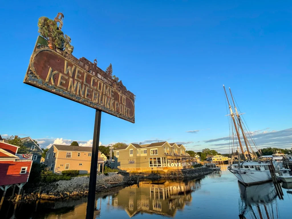 Kennebunk harbor welcome sign near fishing boats and marina, representing small-town businesses that benefit from managed IT services