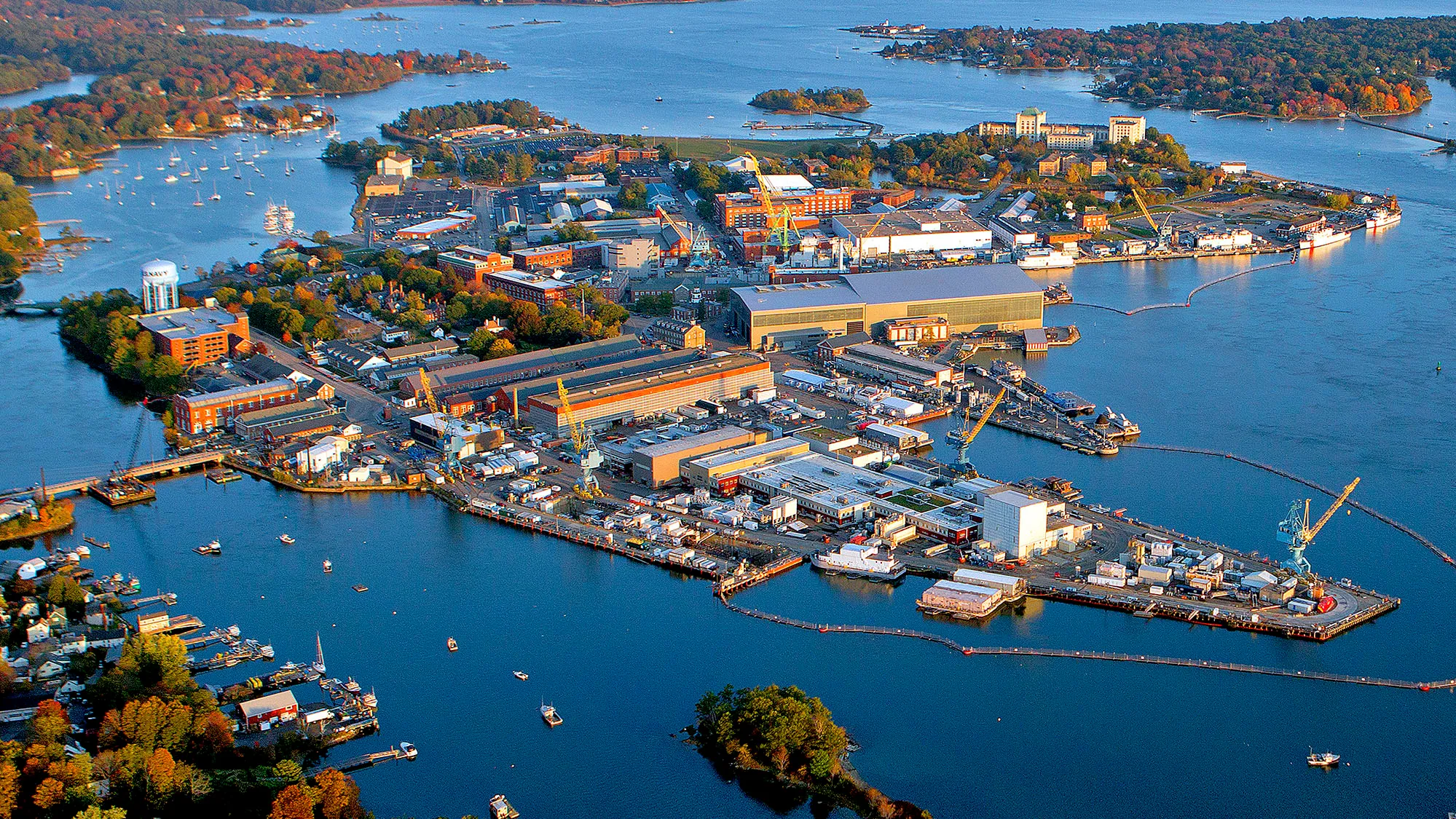 Aerial view of Kittery, Maine’s coastal downtown, highlighting the businesses and harbors that benefit from managed IT solutions.