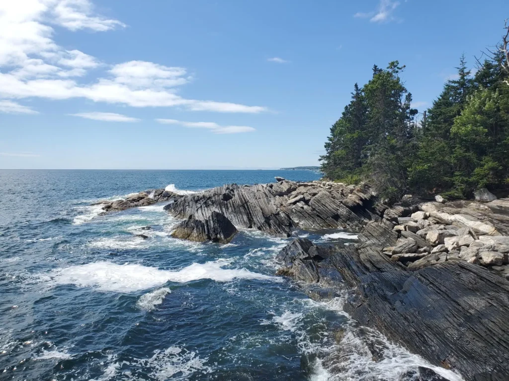 Rocky coastline in Maine near Pemaquid Point, where reliable managed IT services support remote businesses and coastal communities