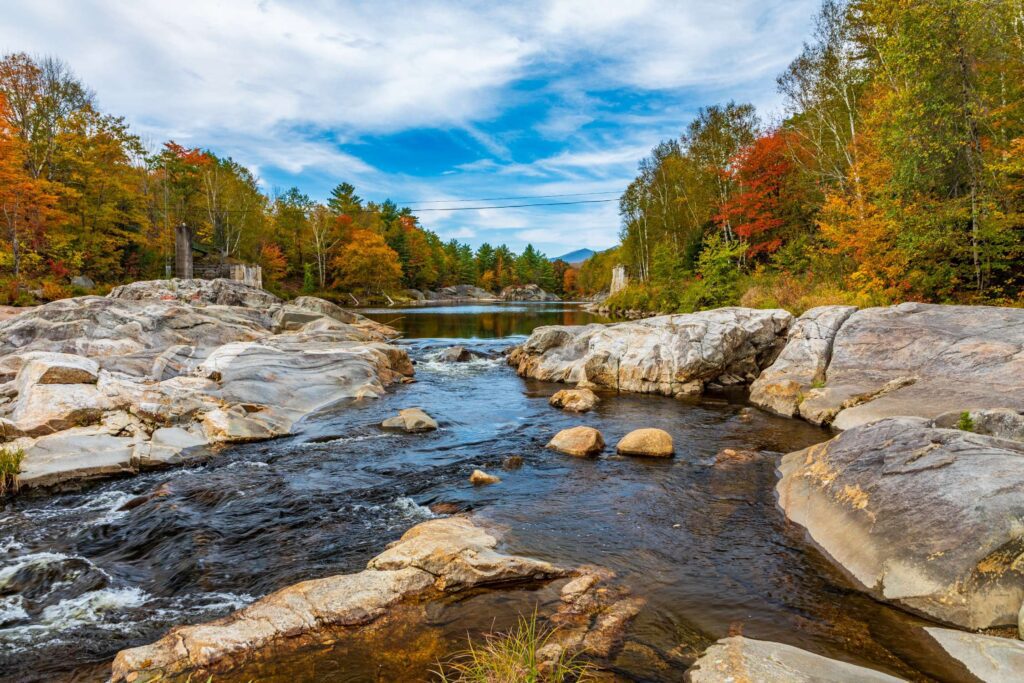 Scenic river view in Livermore Falls, Maine, where managed IT services help preserve business continuity amid natural beauty.