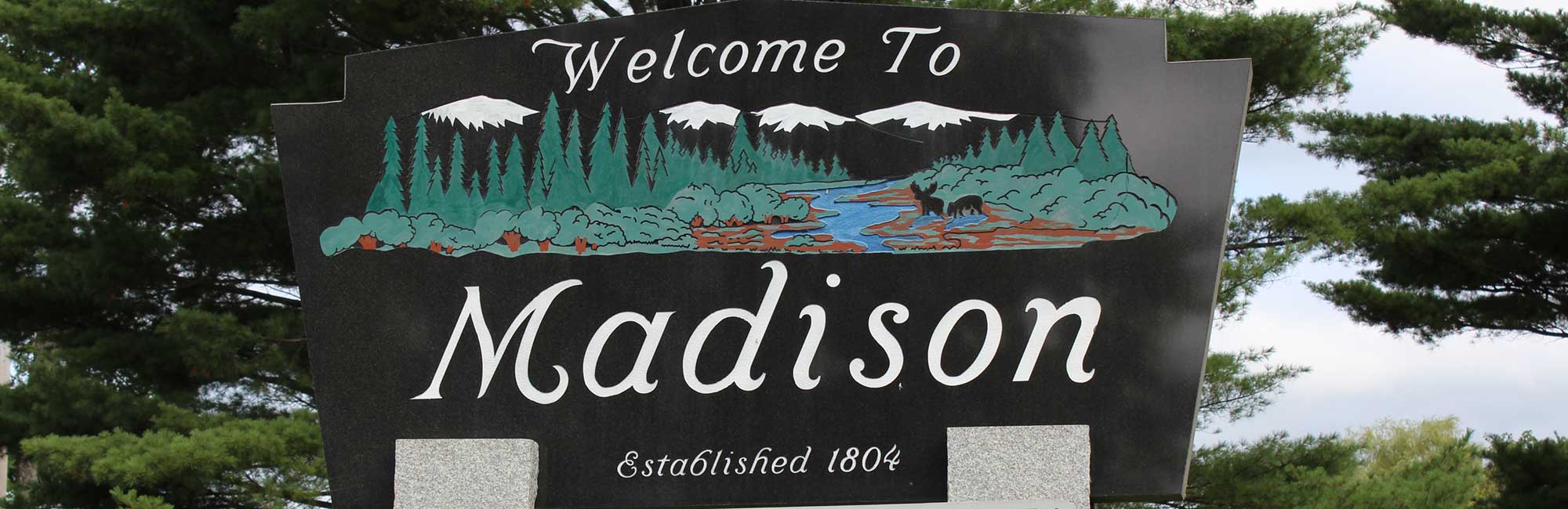 Welcome sign in Madison, Maine—local town embracing managed IT services to support small businesses and community infrastructure.