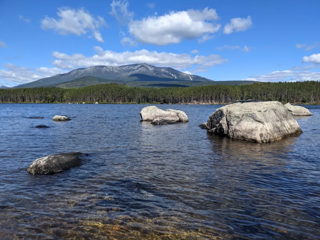 Mount Katahdin reflected in Millinocket Lake, symbolizing the strength and stability managed IT brings to Maine’s remote businesses.
