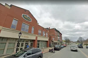 Main Street in Old Town, Maine lined with local businesses that benefit from reliable managed IT support.