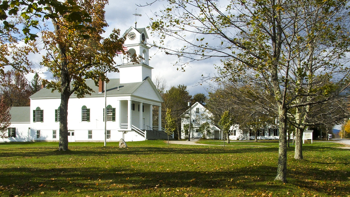 Historic white church and town buildings in Paris, Maine—supporting community charm with modern managed IT services.