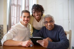Senior residents and caregivers enjoying a smooth digital experience after resolving assisted living Wi-Fi issues.