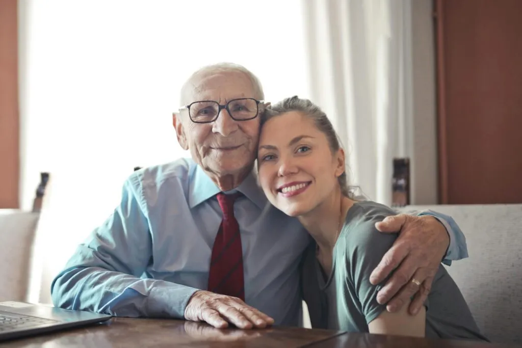 IT technician helping assisted living staff troubleshoot Wi-Fi issues for better connectivity and care.