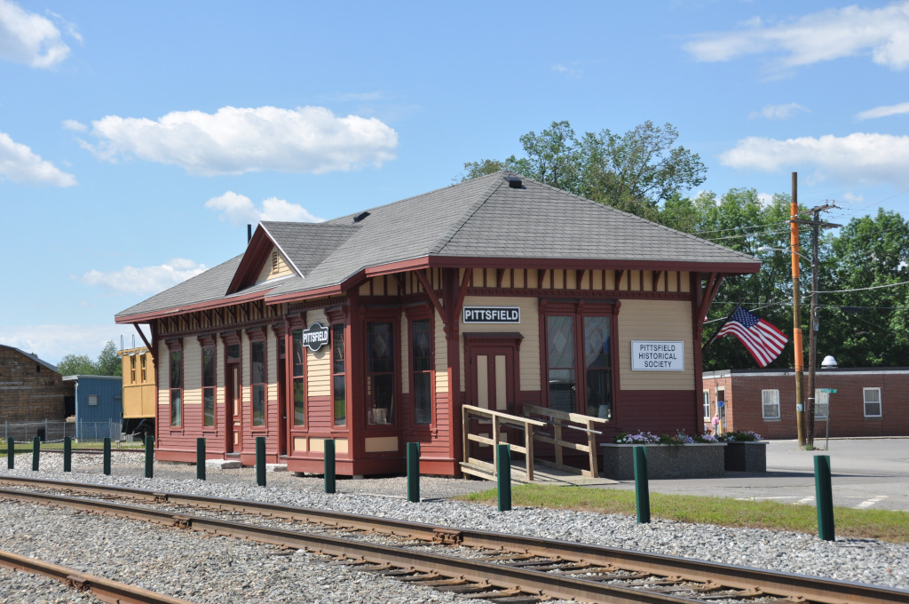 Historic train station in Pittsfield, Maine under a clear blue sky—symbolizing the town’s blend of heritage and modern needs like managed IT support.