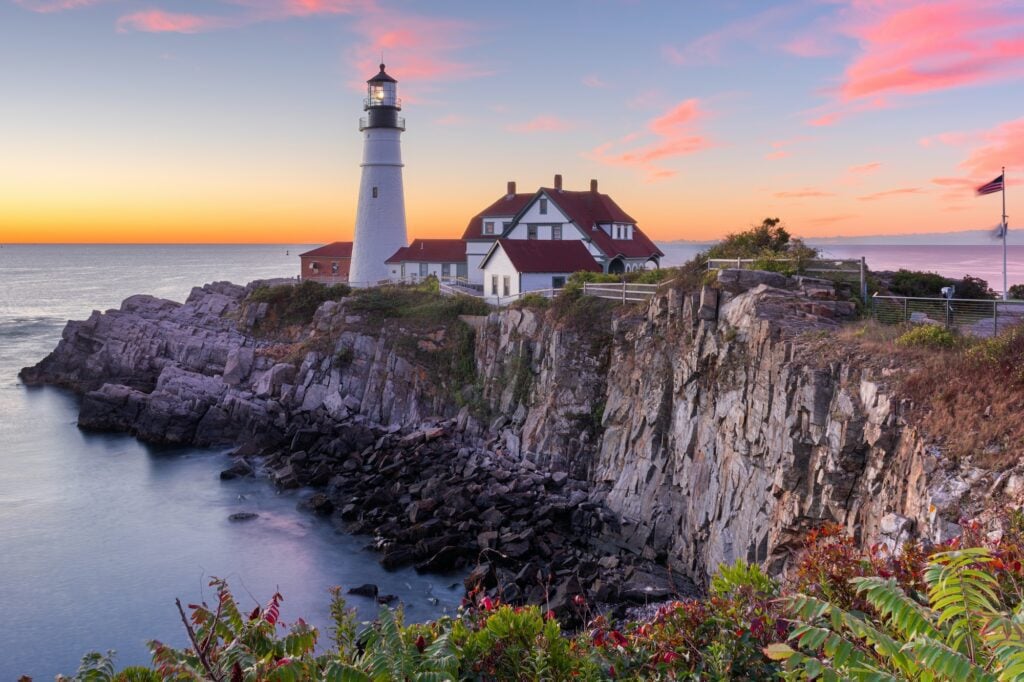 Sunrise at Portland Head Light, symbolizing Maine’s dependable outlook—just like the managed IT services that support local businesses."