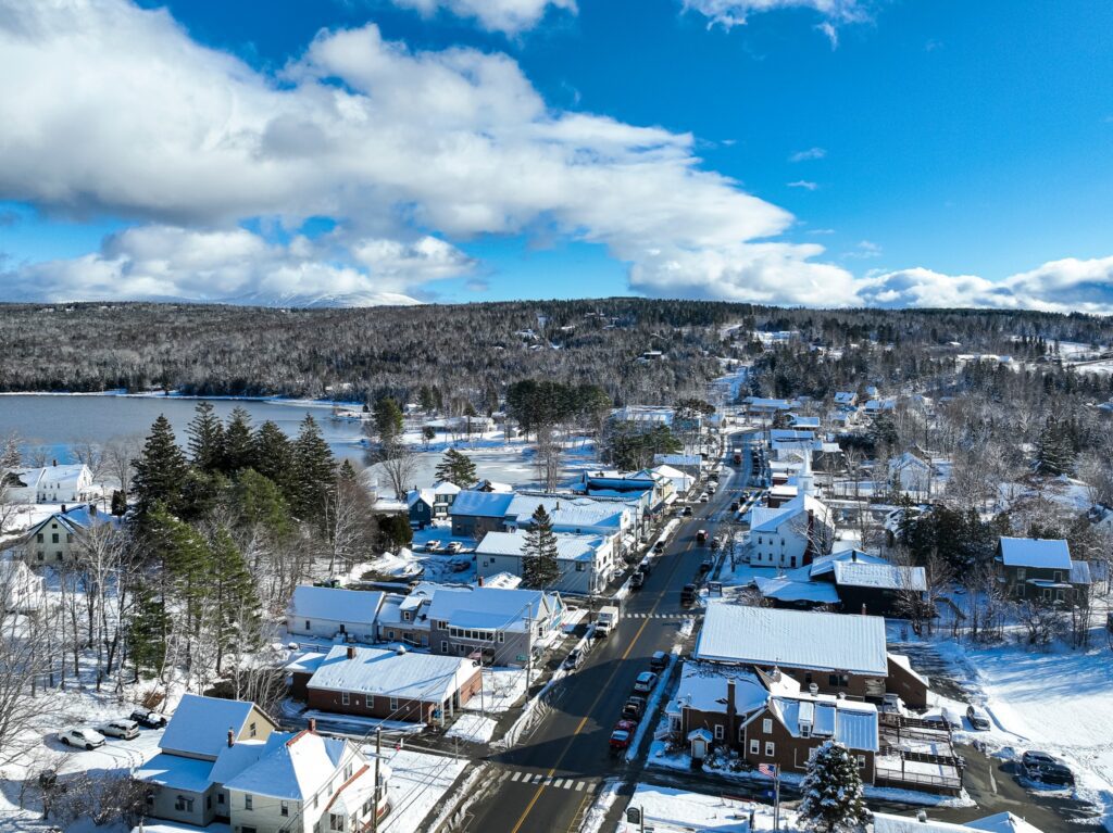 Aerial winter view of downtown Rangeley, Maine, where small businesses rely on managed IT services to stay connected and secure year-round.