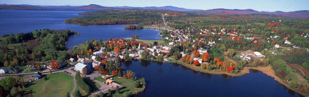 Aerial view of Rangeley, Maine, highlighting the local community that benefits from managed IT services to prevent business disruptions and ensure smooth operations.