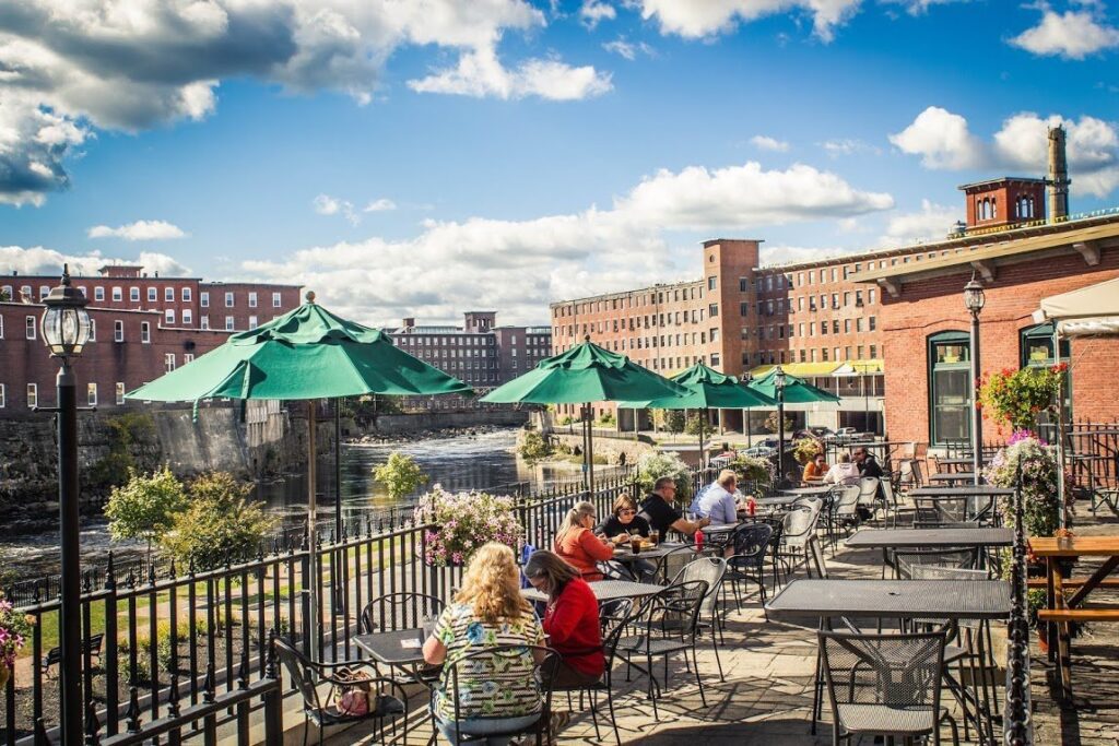 Outdoor dining scene in downtown Saco, Maine on a sunny day—highlighting a vibrant business community supported by reliable managed IT services.