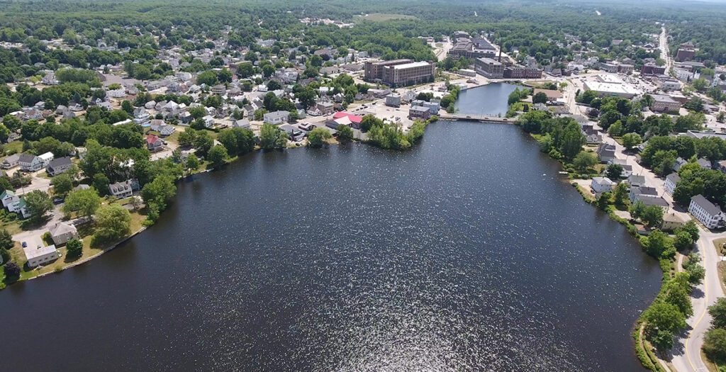 Aerial view of Sanford, Maine’s downtown and waterway—illustrating how managed IT supports community connectivity and local business continuity.