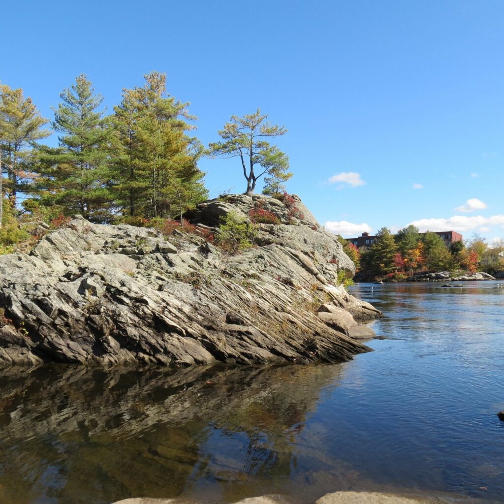 Natural rock formations and river in Topsham, Maine—reflecting the balance between natural beauty and the reliability of managed IT in the region.