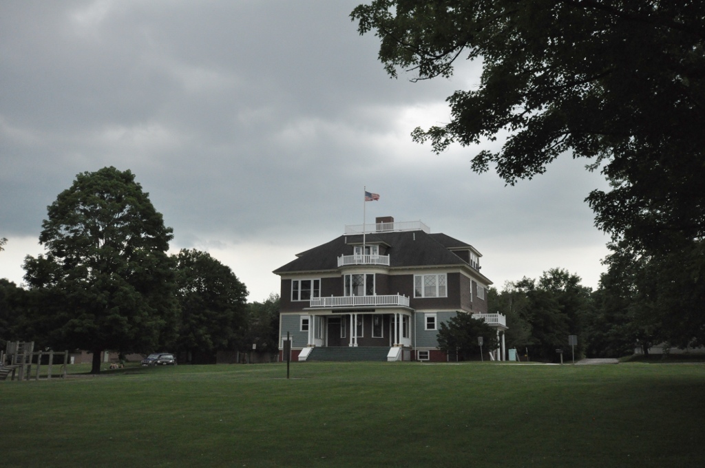 A stately home in Turner, Maine surrounded by trees under a cloudy sky—representing the calm, rural charm of a town supported by reliable managed IT solutions.