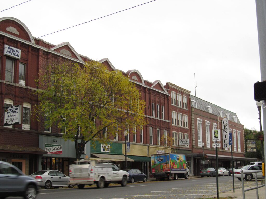 Daytime view of Main Street in Waterville, Maine with historic buildings and small businesses, reflecting the growing need for managed IT support in local commerce.