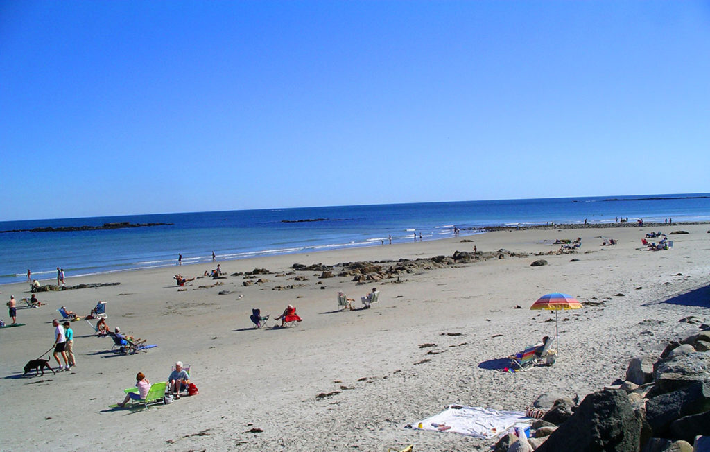 Families relaxing on the beach in Wells, Maine, where local businesses rely on managed IT to keep operations smooth year-round.