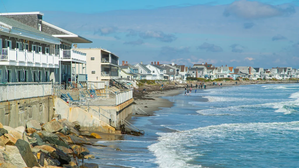 Oceanfront homes and rocky coastline in Wells, Maine, a growing community supported by reliable managed IT services.