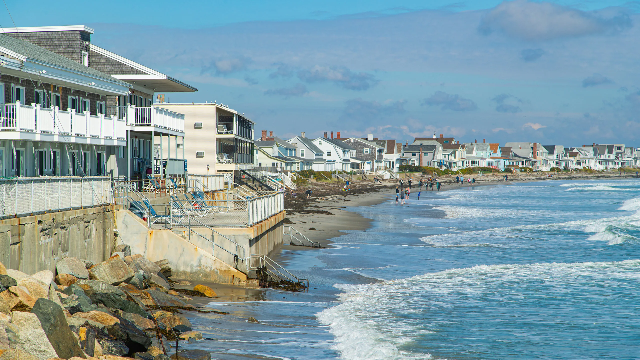 Oceanfront homes and rocky coastline in Wells, Maine, a growing community supported by reliable managed IT services.